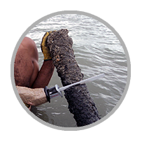 Deep-sea ocean floor cable extraction of decommissioned telecom cables.